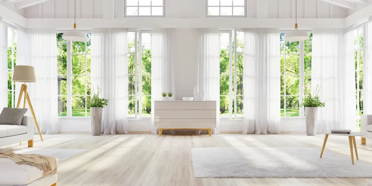 Bright white room with many tall windows