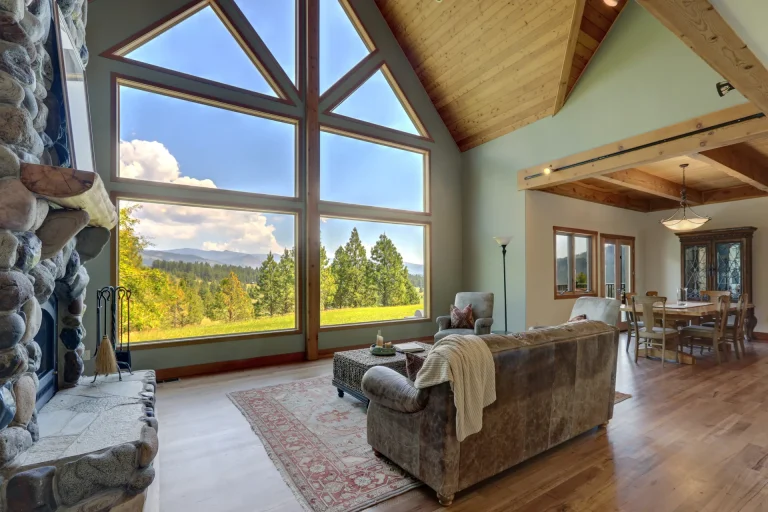 Mountain-view living room with tall gable windows