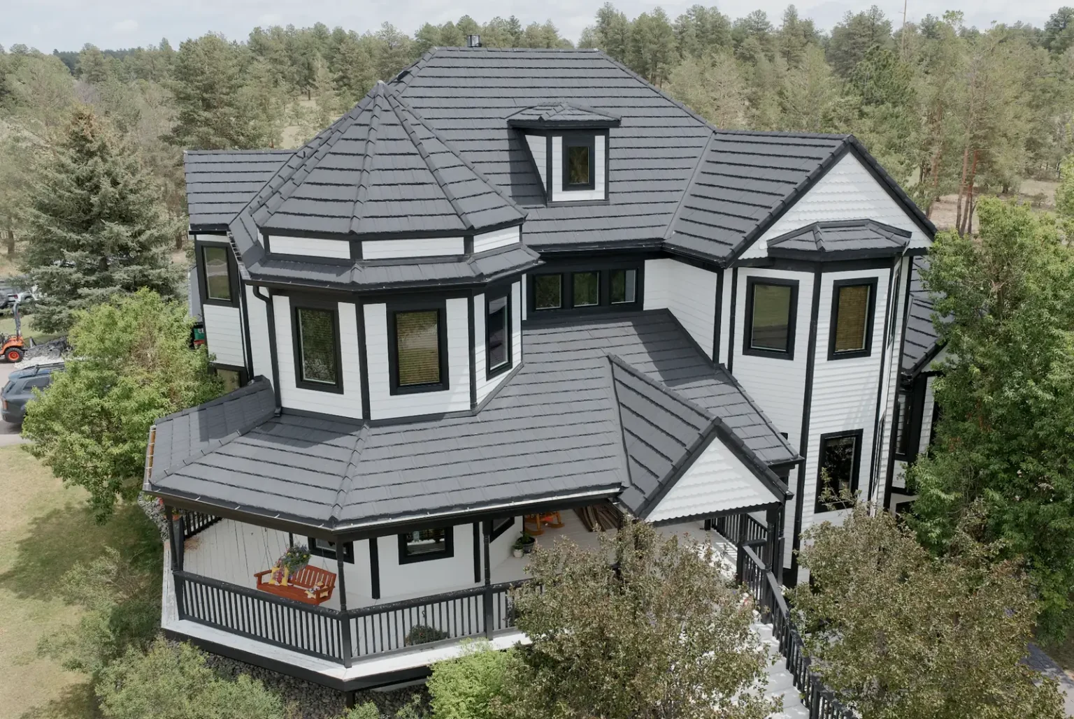 KV Windows whole-home Pella window replacement in Parker, CO: aerial view of a turreted home with black-frame windows