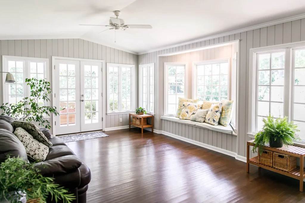 Sunroom with a bay window seat and French doors